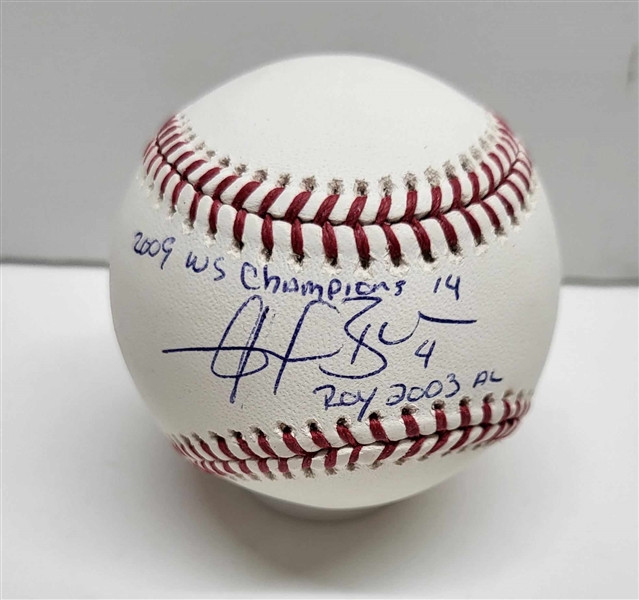 New York Yankees Angel Berroa Signed Baseball With inscriptions 2009 WS Champions & ROY 2003 AL